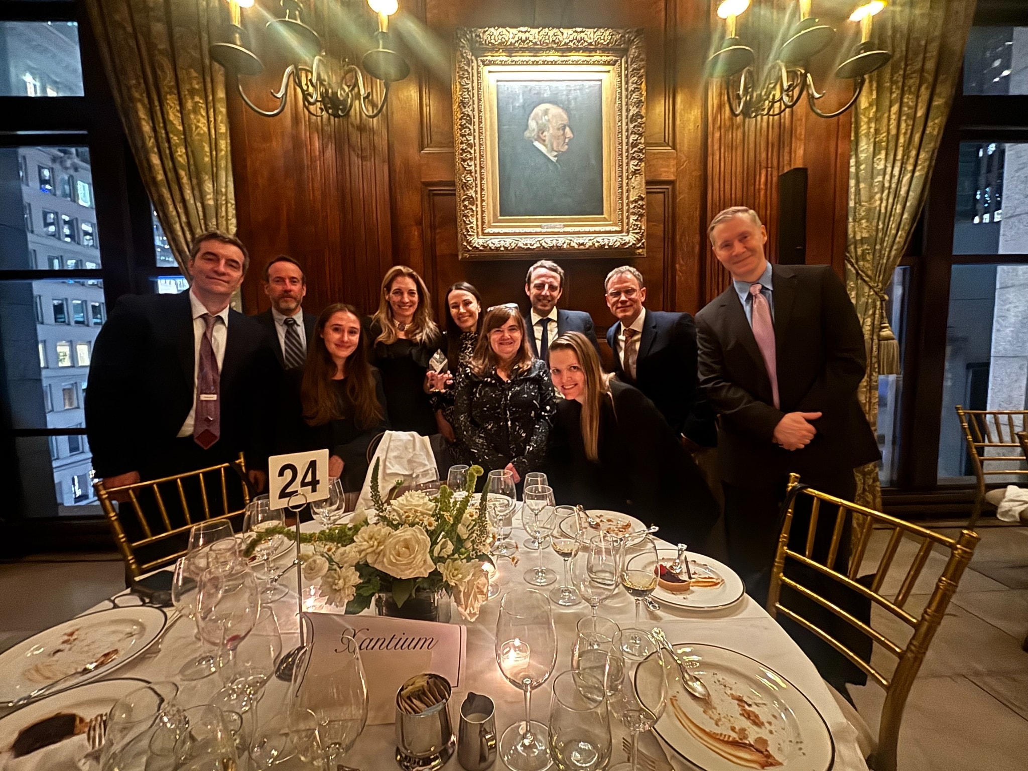 Jacqueline Petts celebrating with Xantium colleagues at a dinner